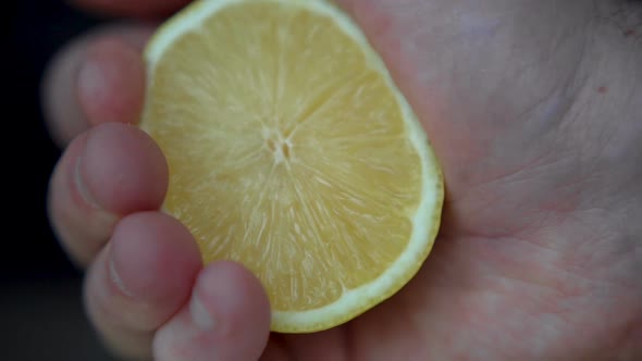 Male Hands are Squeezing Ripe Lemon for Making Citrus Juice  Healthy Lifestyle Fruit Juice alt