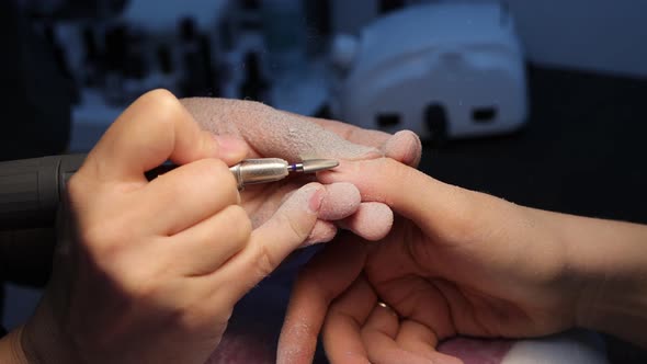 Anonymous Beautician Doing Manicure to Female Client