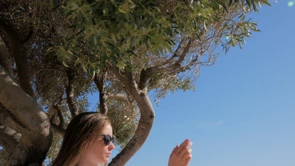 Young Woman Is Capturing By Smartphone View of Nature and Landmarks in Cyprus