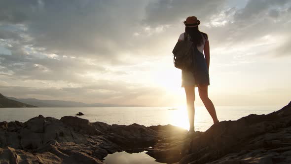 Enthusiastic Travel Backpacker Female Admiring Amazing Sunset Having Positive Emotion alt