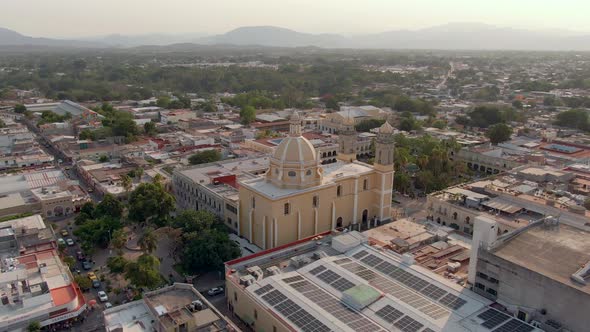 Colima Cathedral And Jardin Libertad In City Of Colima In Mexico. - aerial alt