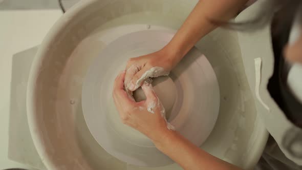 Master Sculpting Clay Vase on Pottery Wheel