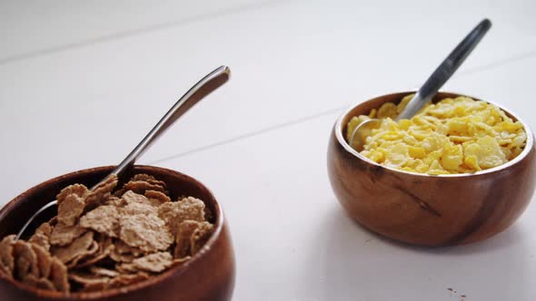 Wheat flakes and wheaties cereal in bowl 4k alt