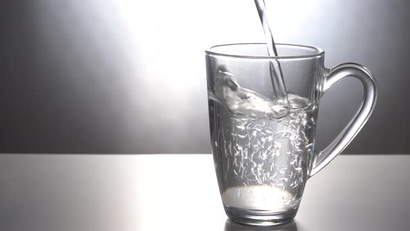 Pour Water Into a Glass Mug alt