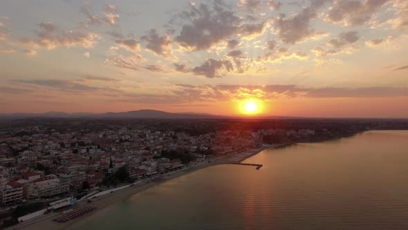 Aerial Scene of Coastal Town at Sunrise. Nea Kallikratia, Greece alt