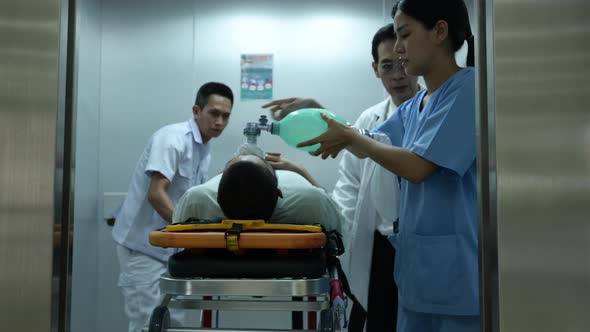 First aid assistance of the ambulance medical team with CPR method alt