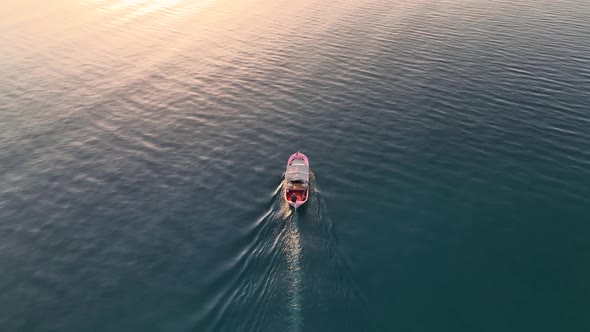 Sunrise Fishing boat goeas to sea aerial view Turkey Alanya 4 K alt
