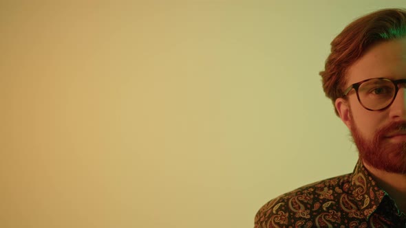 Half of the Face Shot  Young Stylish Bearded Red Hair Man Smiling to the Camera  Copy Space Shot alt