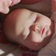 Close Up Mother Gently Kissing Baby Enjoying Loving Mom Playfully Caring for Toddler at Home Sharing