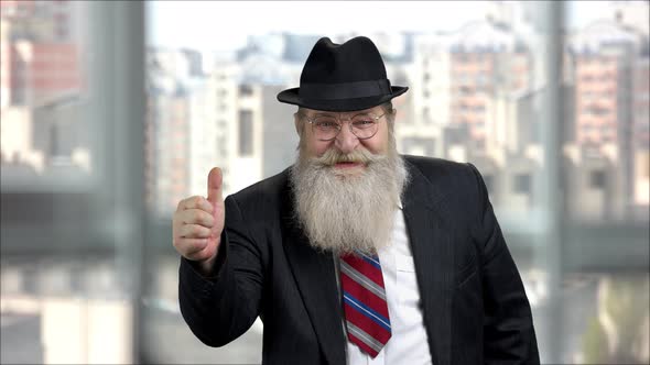 Senior Longbearded Man Showing Thumb Up alt