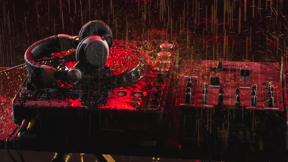Professional Console Deck Turntable and Headphones in a Dark Studio. Raindrops Fall on the alt