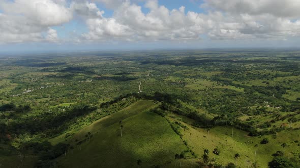 Fluffy White Clouds are Floating in the Sky Over the Valleys Dominican Republic alt