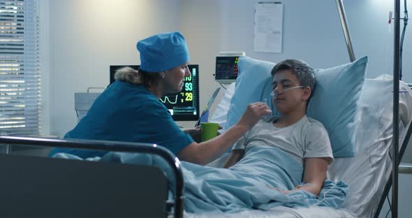 Nurse Lubricating Patients Mouth with Cotton Swab alt