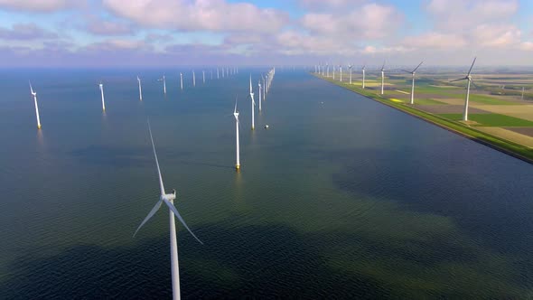 Wind Turbines in the Early Morning Wind Mill Park in the Netherlands alt
