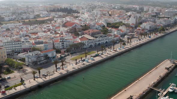 Aerial Drone Flying Above Sea Water Cannal in Lagos Harbor Portugal Dolly in Day alt