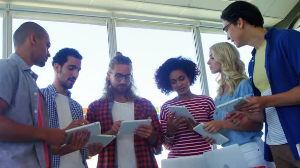 Executives using digital tablet 4k alt