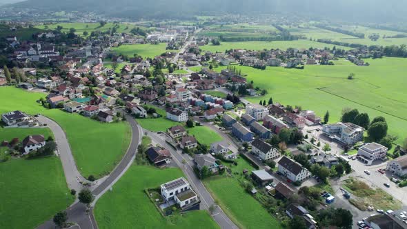 Aerial View of Liechtenstein with Houses on Green Fields in Alps Mountain Valley alt