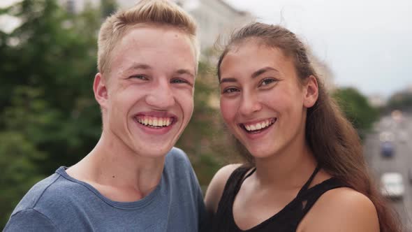 Multi-ethnic Teenage Couple Having Fun Laughing in City