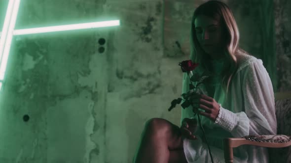 Beautiful Woman in an abandoned green Room alt