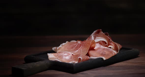 The Fresh Antipasto on the Cutting Board Slowly Rotates. alt