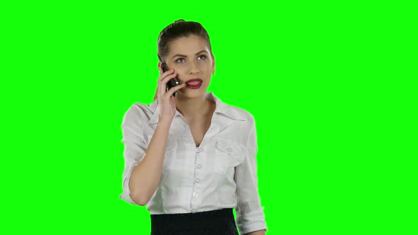 Pretty Businesswoman Talking on the Phone. Green Screen alt