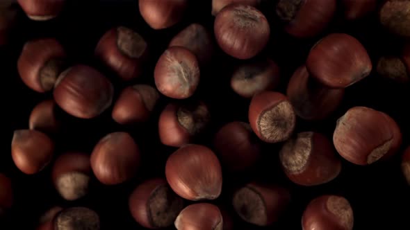 Super Slow Motion Hazelnuts Take Off and Fall Down alt