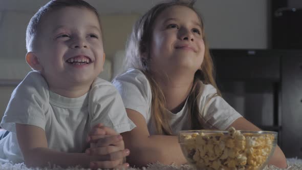 Cute Little Kids While Watching TV alt
