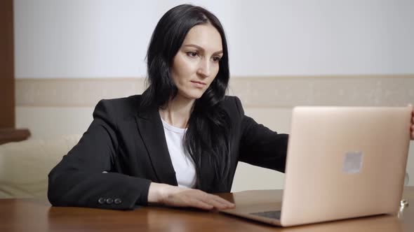 Confident Positive Caucasian Woman Opening Laptop and Talking Smiling alt