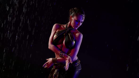 Sexy Female Belly Dancer is Posing in Darkness Medium Portrait Under Rain at Night alt