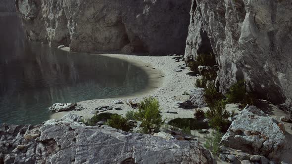 Beach Coast of the Norwegian Sea with Mountains and Cliffs on Sunny Day alt