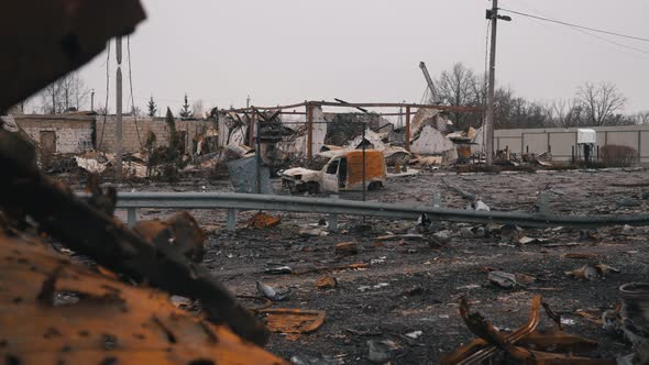 Destroyed Houses and a Car of Civilians in the War in Ukraine