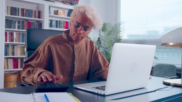 Unhappy Woman Calculating Expenditures or Taxes Feeling Stressed of Mistakes alt