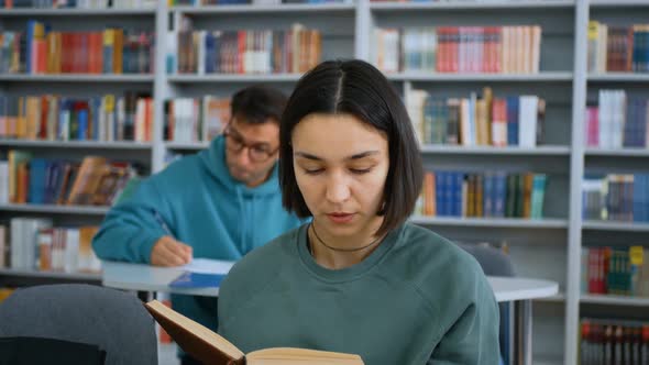 Closeup Portrait of a Young Attractive Student Guy and a Young Cheerful Female Student They are