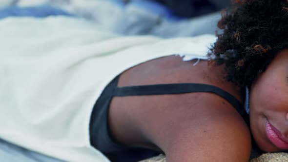 Woman sleeping in the tent alt