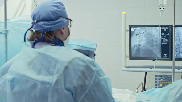 Surgeon Performing Bypass Grafting alt