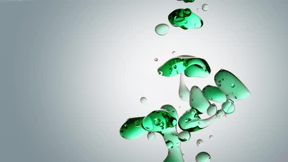 Isolated Highspeed Green Oil Bubbles and Shapes on White Background