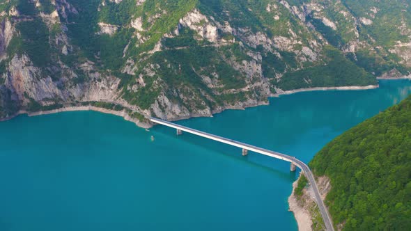 Aerial View on Bridge Over Lake Piva with Mountains of Canyon in Montenegro alt