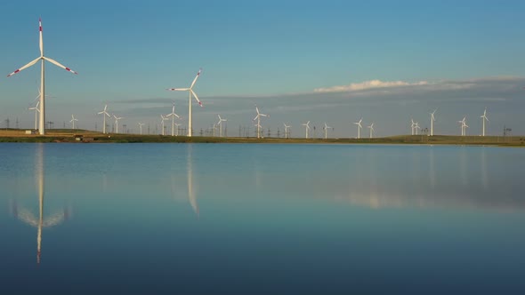 Windmills Turbines with Water Reflection alt