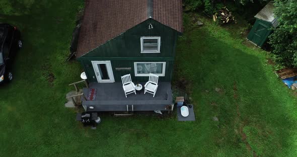 A drone zoom in on a small cabin in the Catskill Mountains in New York state.  Secluded and quiet. alt