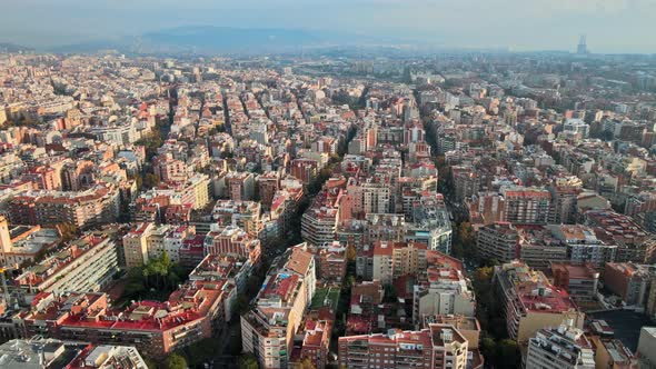 Aerial drone view of Barcelona, Spain. Blocks with multiple residential buildings, roads with cars alt