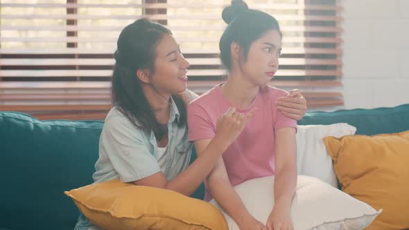 Young Lesbian lgbtq Asian women couple angry conflict together at home. alt