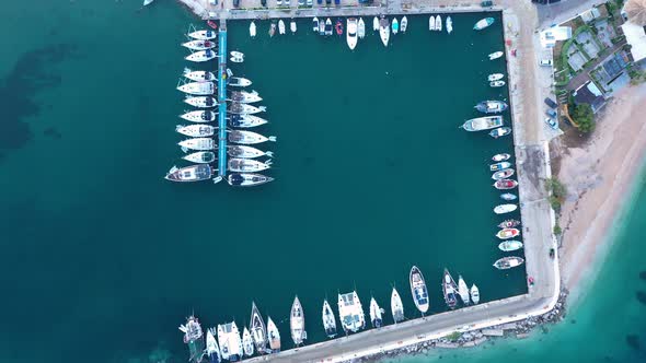 Top down view of yachts in the marina. Sailboats and regular Boats moured alt
