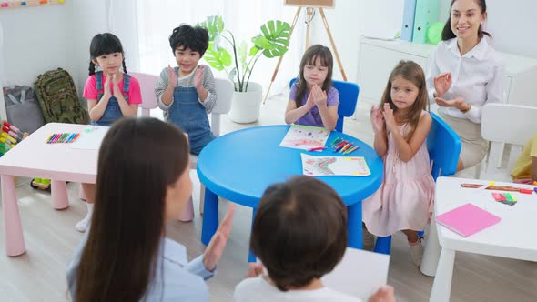 Asian beautiful young woman teacher teaching a lesson to kid in classroom at school. alt