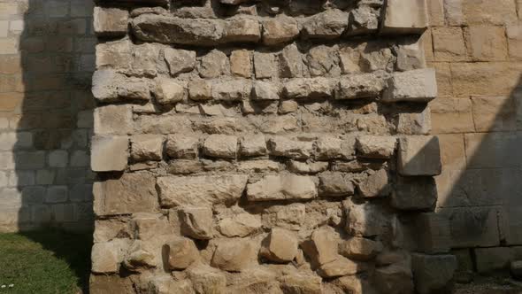 Ancient castle protecting wall cross-section  with lot of rock levels 4K 2160p 30fps UltraHD titlitn alt