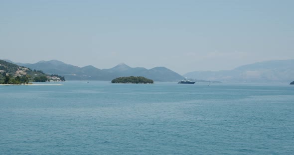 Luxury Sailing Yacht Boat at Anchor Moored in Sea Bay Between Islands
