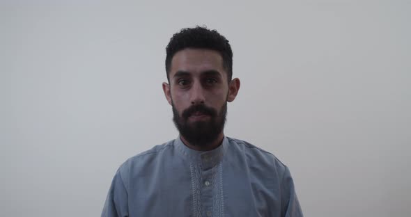 Middle eastern man looking at the camera