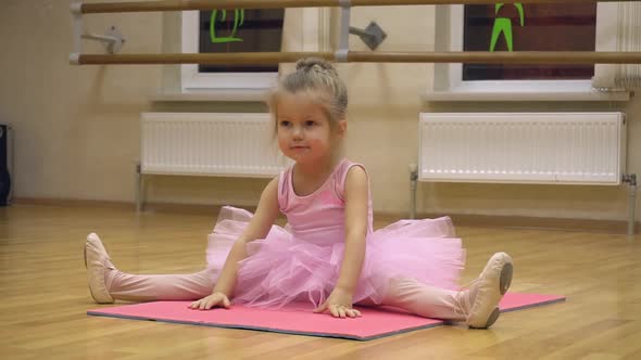 Little Ballerina in Pink Dress Doing Choreography Practice