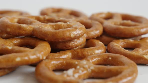 Close-up tasty pretzel snack  on white background  slow tilt 4K 2160p 30fps UltraHD footage - Tiltin alt