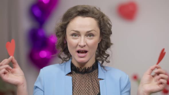 Closeup Portrait of Gorgeous Adult Excited Funny Brunette Woman with Green Eyes Closing with Heart alt