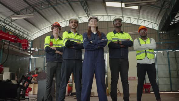 Multinational team of factory engineers ,leadership by engineer women are standing with confidence